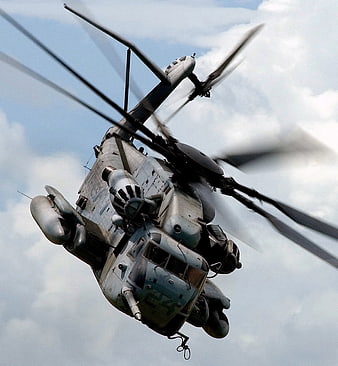 Military Chinook Helicopter Flying in Cloudy Sky