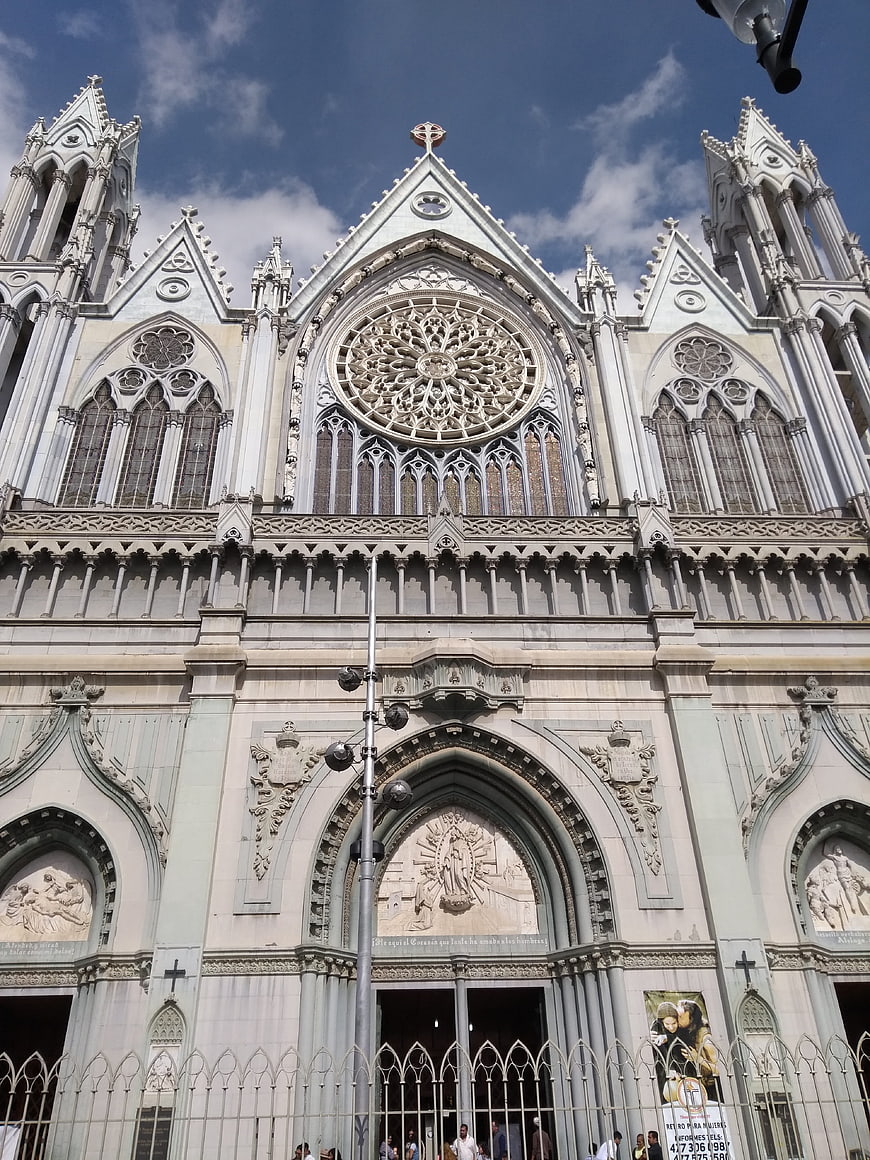 Low angle view of ornate Gothic cathedral facade with rose window