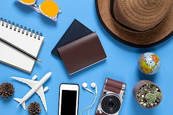Summer Travel Essentials Flat Lay on Blue Background
