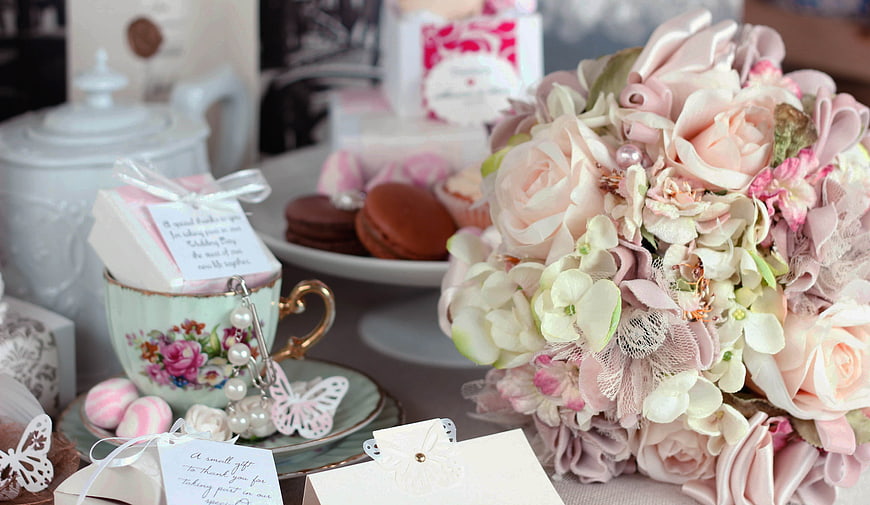 Vintage Tea Party Table with Pink Floral Bouquet and Macarons