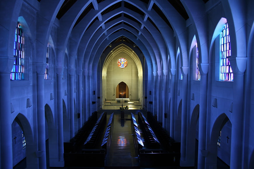 Blue Gothic Church Interior with Stained Glass Windows