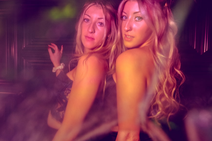 Two Young Women at Nightclub Party