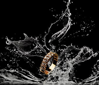 Gold Diamond Ring With Dynamic Water Splash On Black Background