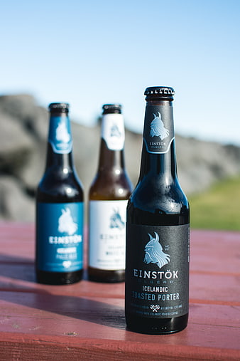 Icelandic Craft Beer Bottles on Wooden Table Outdoors