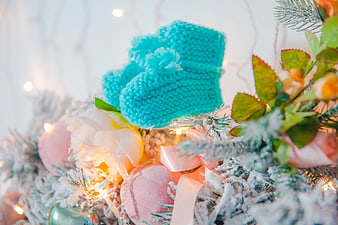 Teal Knitted Socks on Frosted Christmas Tree with Lights
