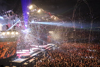 Rock concert stage with confetti and cheering crowd