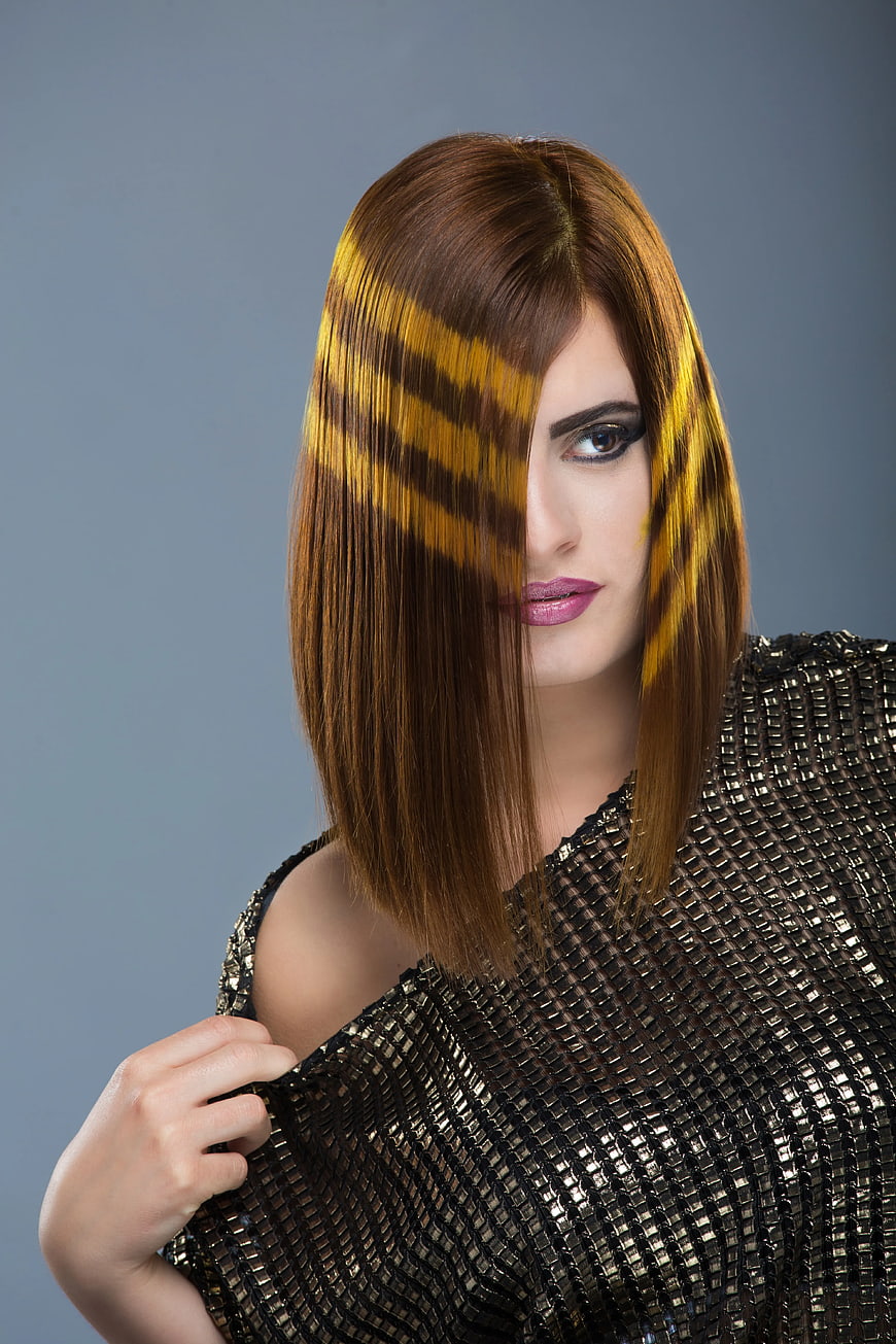 Fashion Portrait of Woman with Striped Light Shadows on Face
