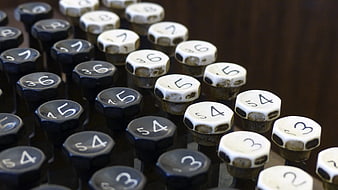 Close-up of vintage mechanical adding machine keys with numbers
