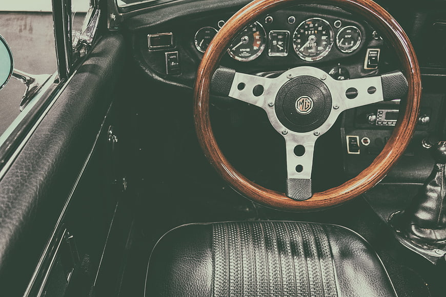Vintage MG Car Interior with Wooden Steering Wheel