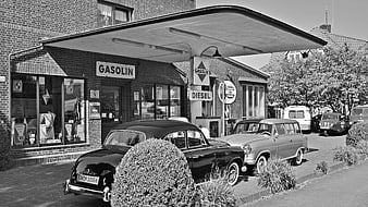 Vintage Black and White Gas Station with Classic Cars