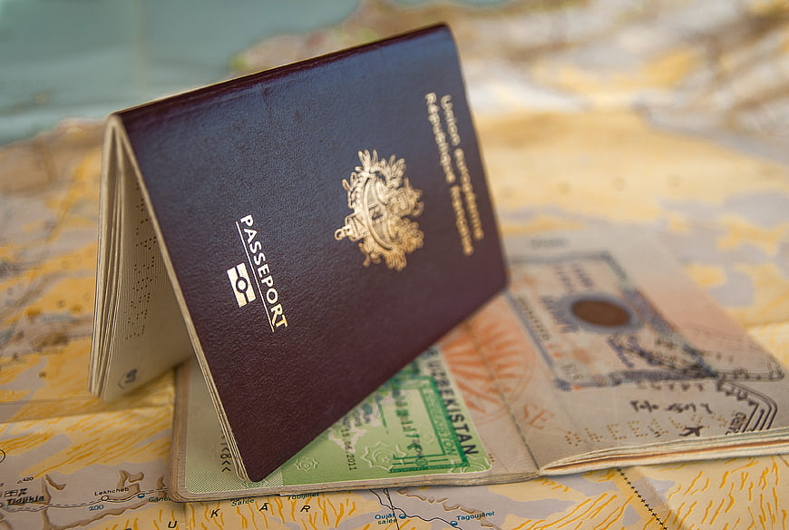 Open Passport With Uzbekistan Visa On Vintage Map