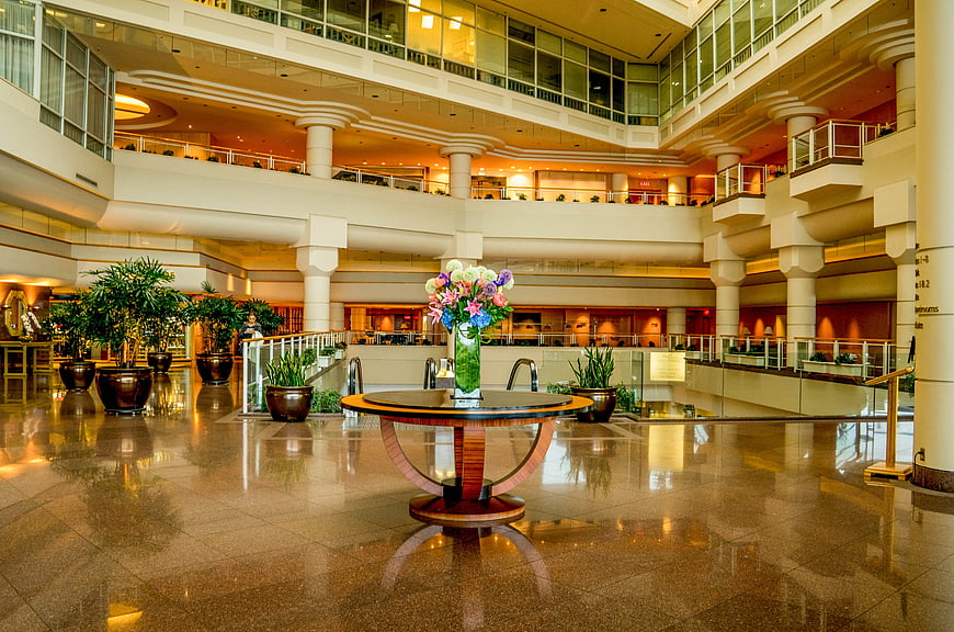 Luxurious hotel lobby with polished floors and floral centerpiece