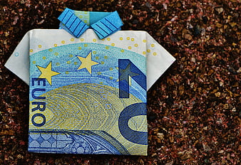 Folded 20 Euro Banknote Shirt on Gravel Background