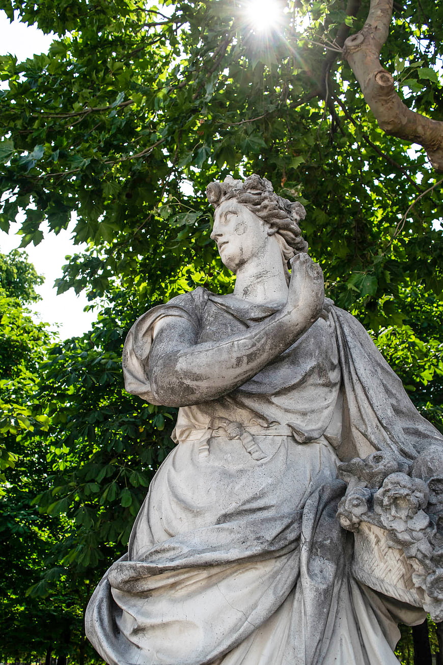 Classical Marble Statue in Sunlit Garden