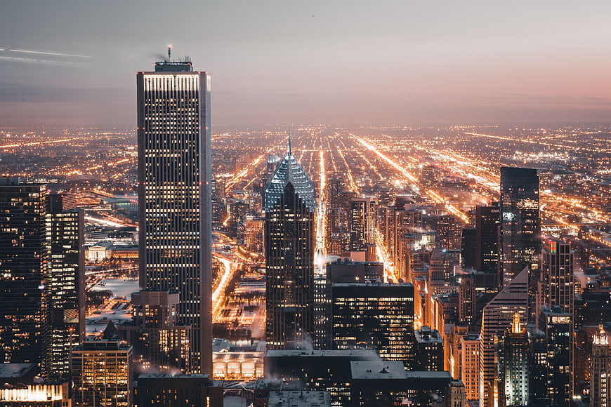 Aerial View of Chicago Skyline at Dusk with City Lights