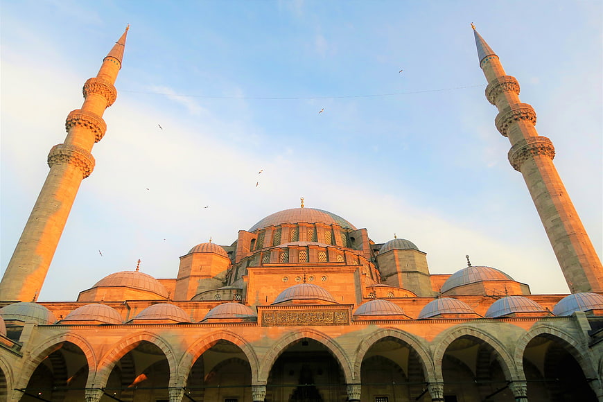 Grand Mosque Architecture with Minarets at Sunset