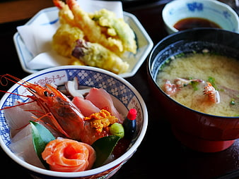 Traditional Japanese seafood donburi, tempura, and miso soup set