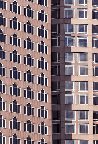 Modern Apartment Building Facade with Arched and Rectangular Windows