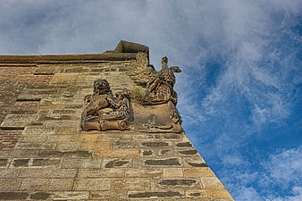 Ancient Stone Coat of Arms Sculpture on Historic Building