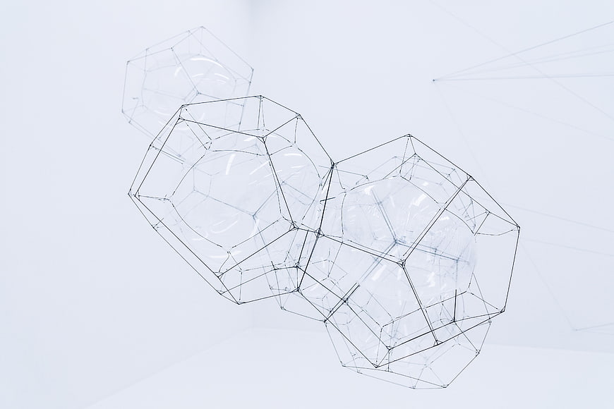 Abstract Geometric Wireframe Sculpture on White Background