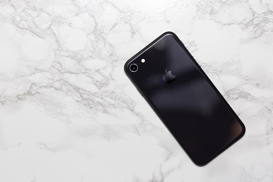 Black Smartphone Flat Lay on White Marble Background