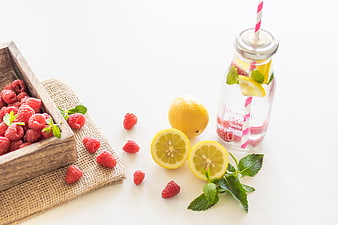 Fresh Raspberry Lemon Detox Water in Glass Bottle