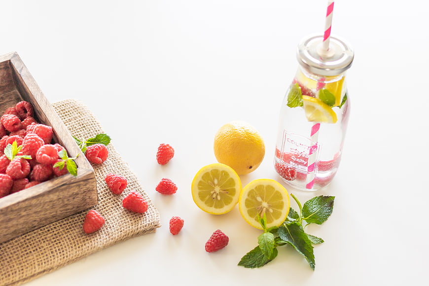 Fresh Raspberry Lemon Detox Water in Glass Bottle