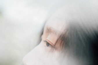 Close-up of woman's eye with soft focus and dreamy atmosphere