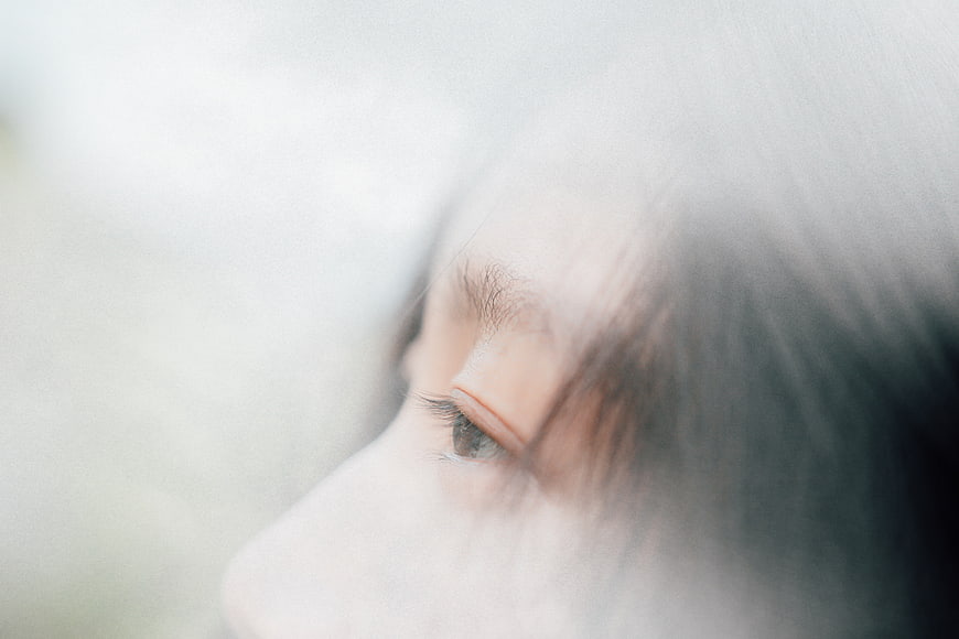 Close-up of woman's eye with soft focus and dreamy atmosphere