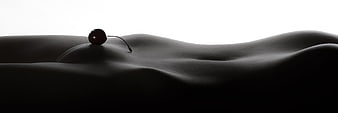 Minimalist Dark Body Landscape With Single Cherry