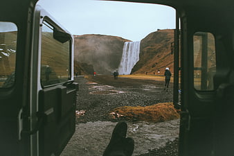 View of Skógafoss Waterfall from Open Van Door