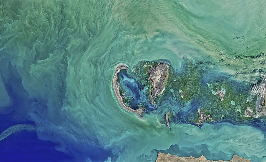 Aerial view of Caspian Sea islands and swirling water patterns