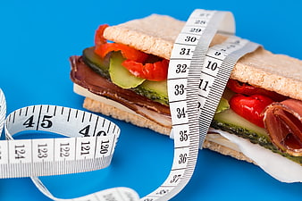 Healthy Sandwich With Tape Measure On Blue Background