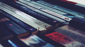Stack of paperback novels with blurred background