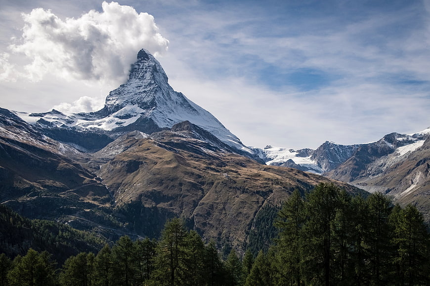 Matterhorn Mountain Peak with Clouds and Forest