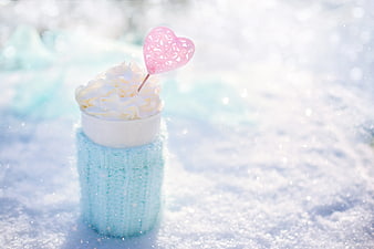 Hot Chocolate with Whipped Cream and Heart in Snow