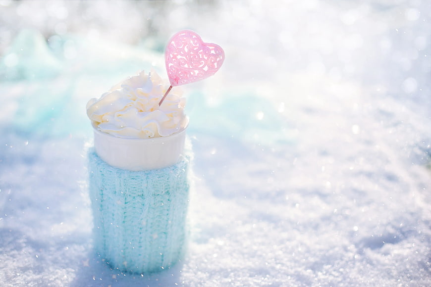Hot Chocolate with Whipped Cream and Heart in Snow