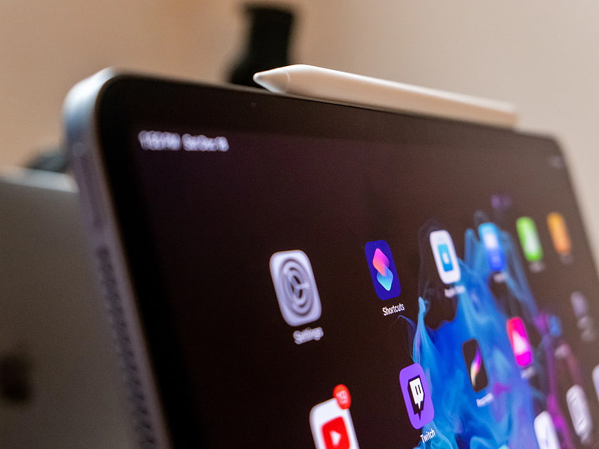 Close-up of iPad Screen with Apple Pencil and App Icons