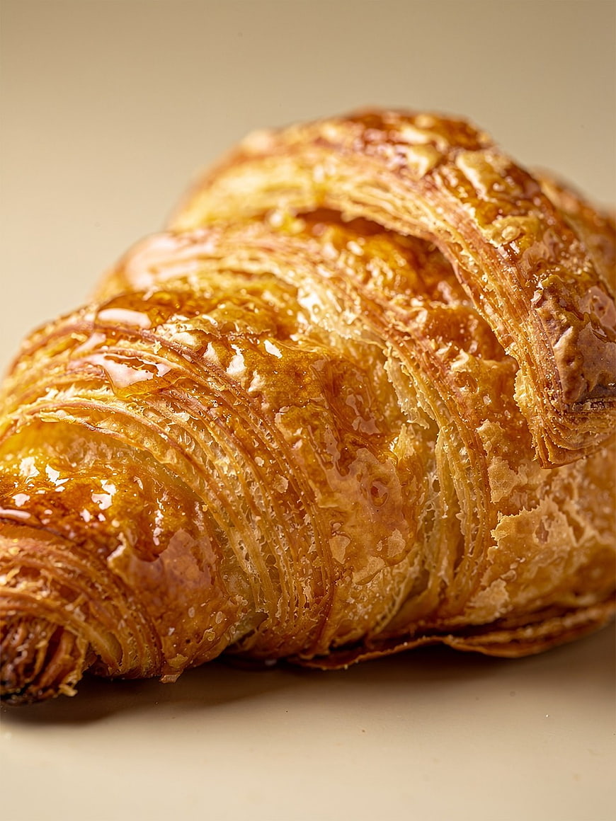 Close-up of Golden Flaky Croissant Pastry