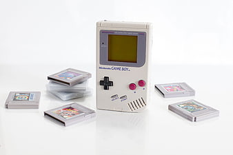 Retro Nintendo Game Boy Console with Cartridges on White Background