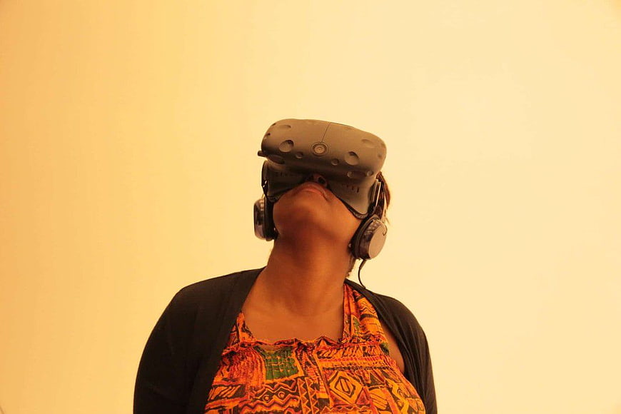 Woman Wearing VR Headset and Headphones