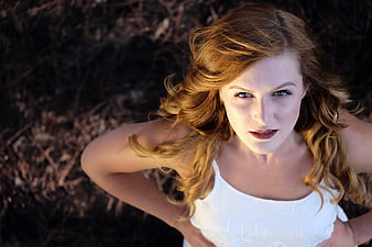 High angle portrait of woman with red hair looking up
