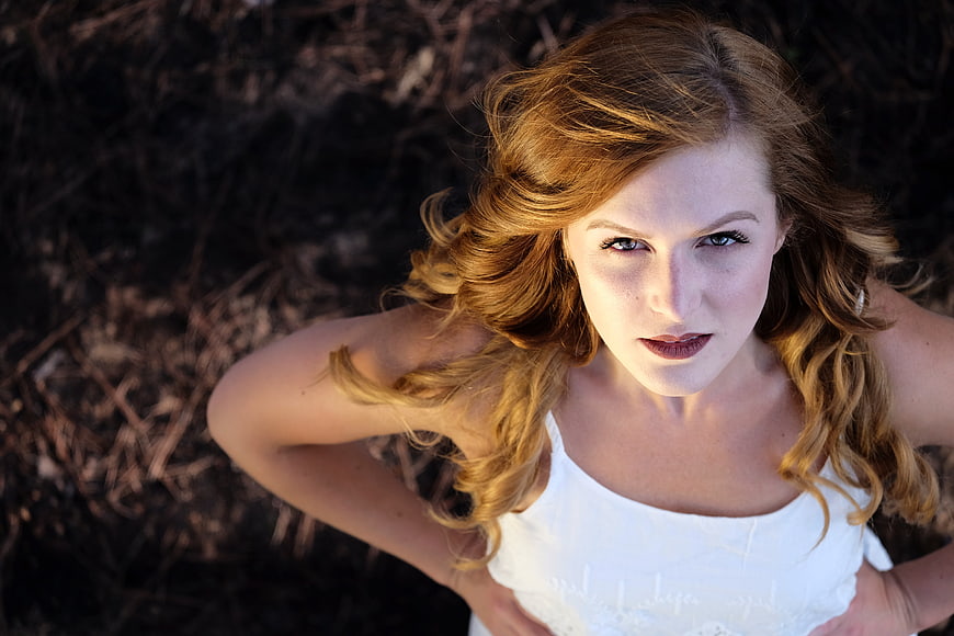 High angle portrait of woman with red hair looking up