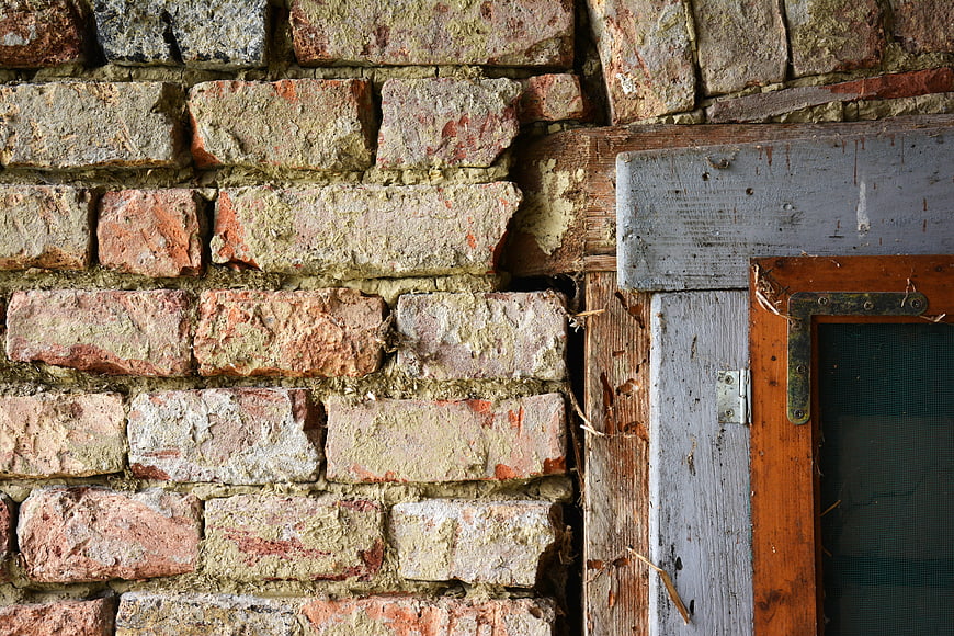 Weathered Brick Wall and Old Wooden Window Frame Texture