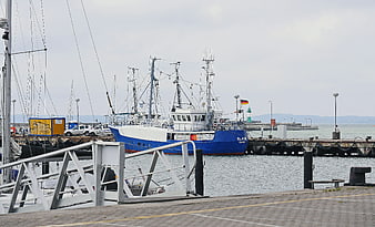 Blue and white trawler docked at Sassnitz harbor
