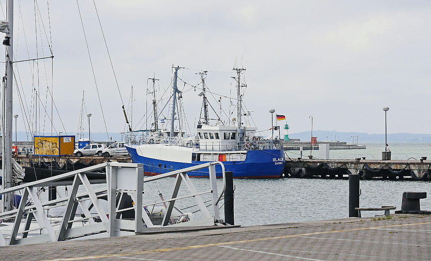 Blue and white trawler docked at Sassnitz harbor