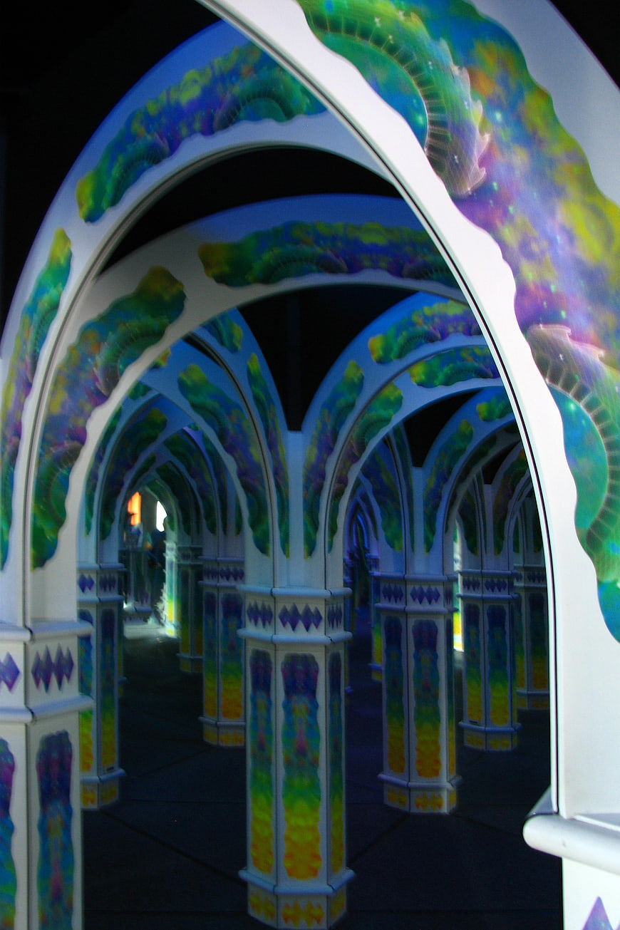 Colorful mirror maze with arches and reflections