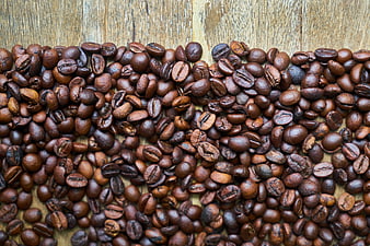 Roasted Coffee Beans on Rustic Wooden Background
