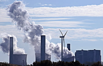 Coal Power Plant Smokestacks and Wind Turbine Energy Transition