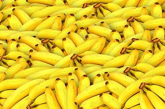Close-up of a large pile of ripe yellow bananas